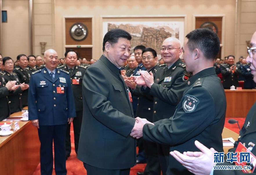 3月12日上午,中共中央總書記、國家主席、中央軍委主席習近平出席十三屆全國人大一次會議解放軍和武警部隊代表團全體會議。